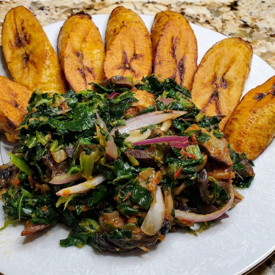 Plate of sautéed leafy greens and vegetables surrounded by grilled plantain slices on a granite countertop.